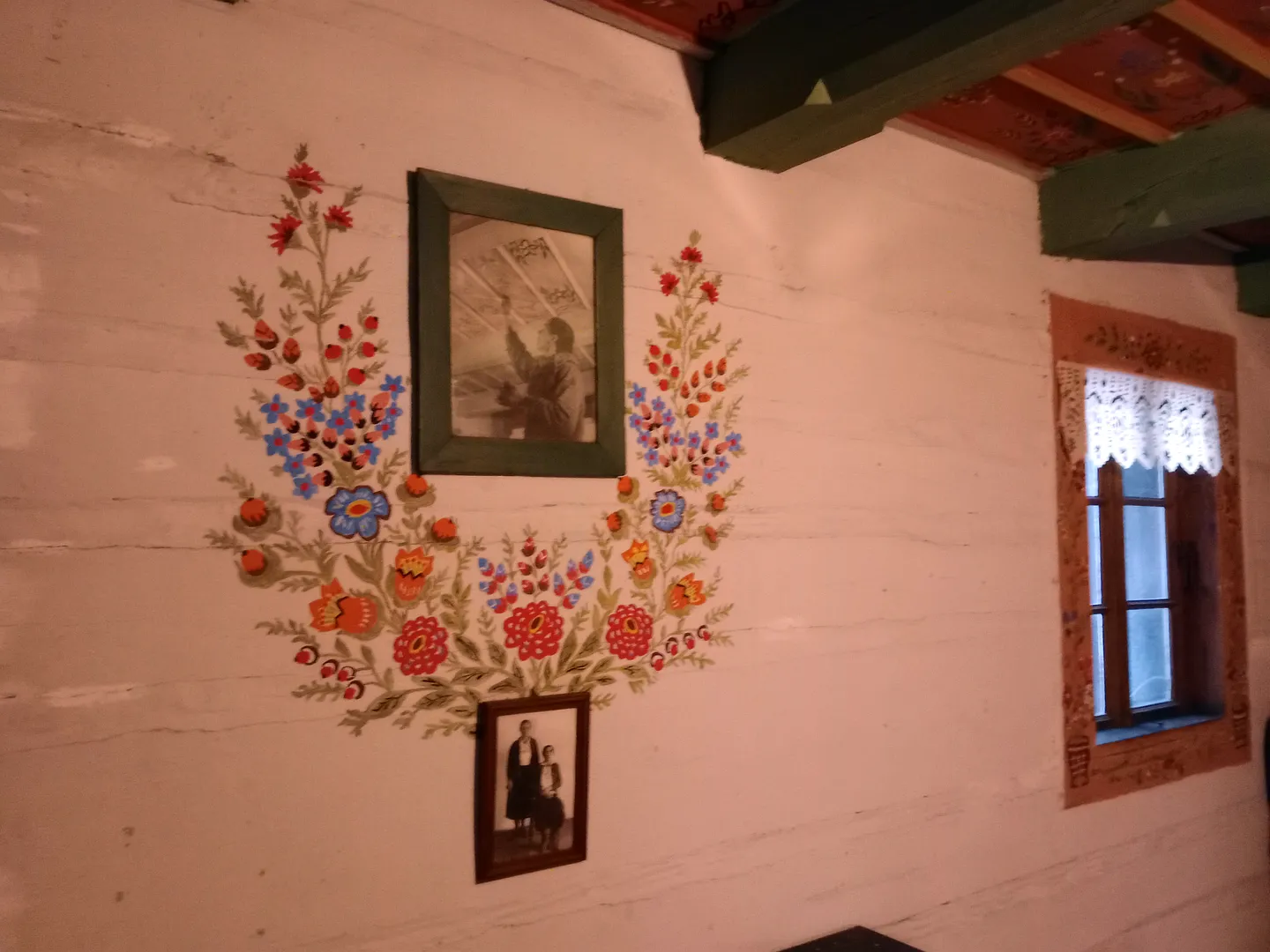 Traditional floral folk art and old photos of people
